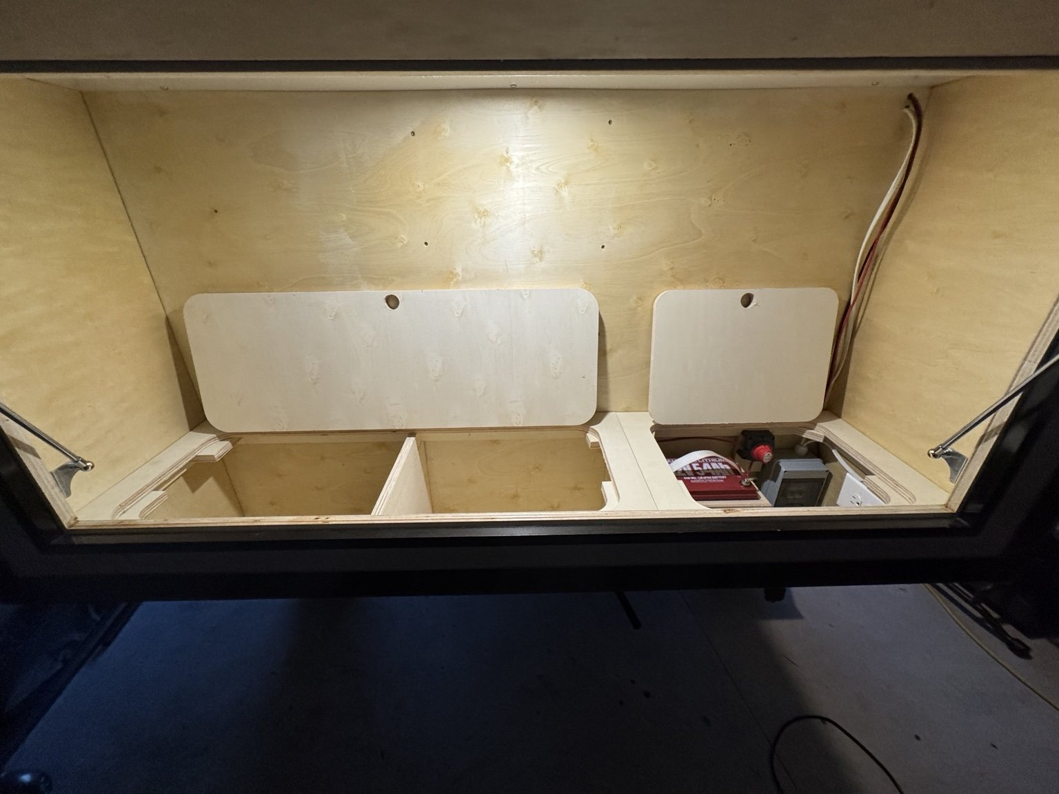 Lower galley storage lids open on a Hatch Backroads trailer